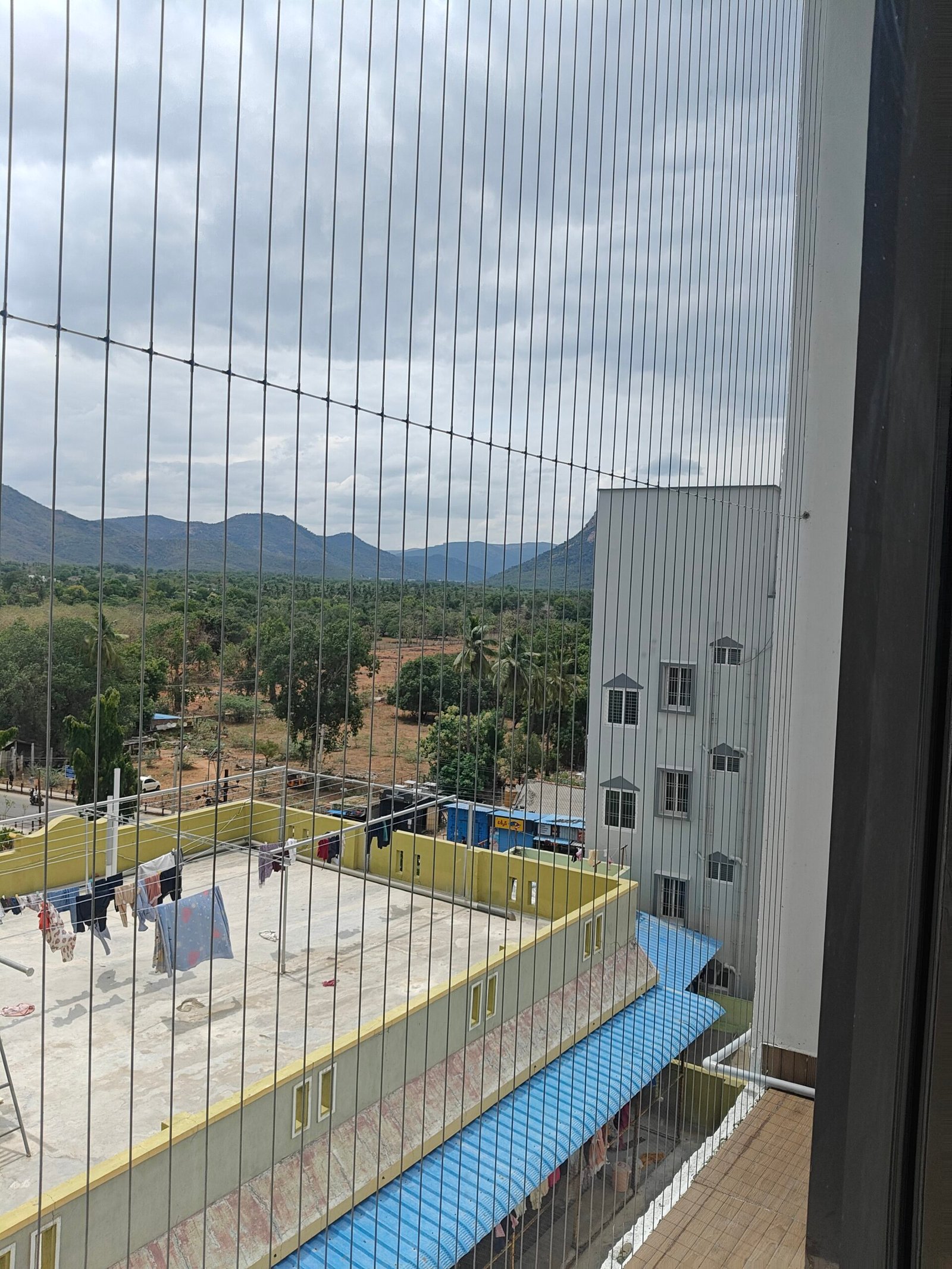 Invisible Grills in Chennai installed on apartment balcony