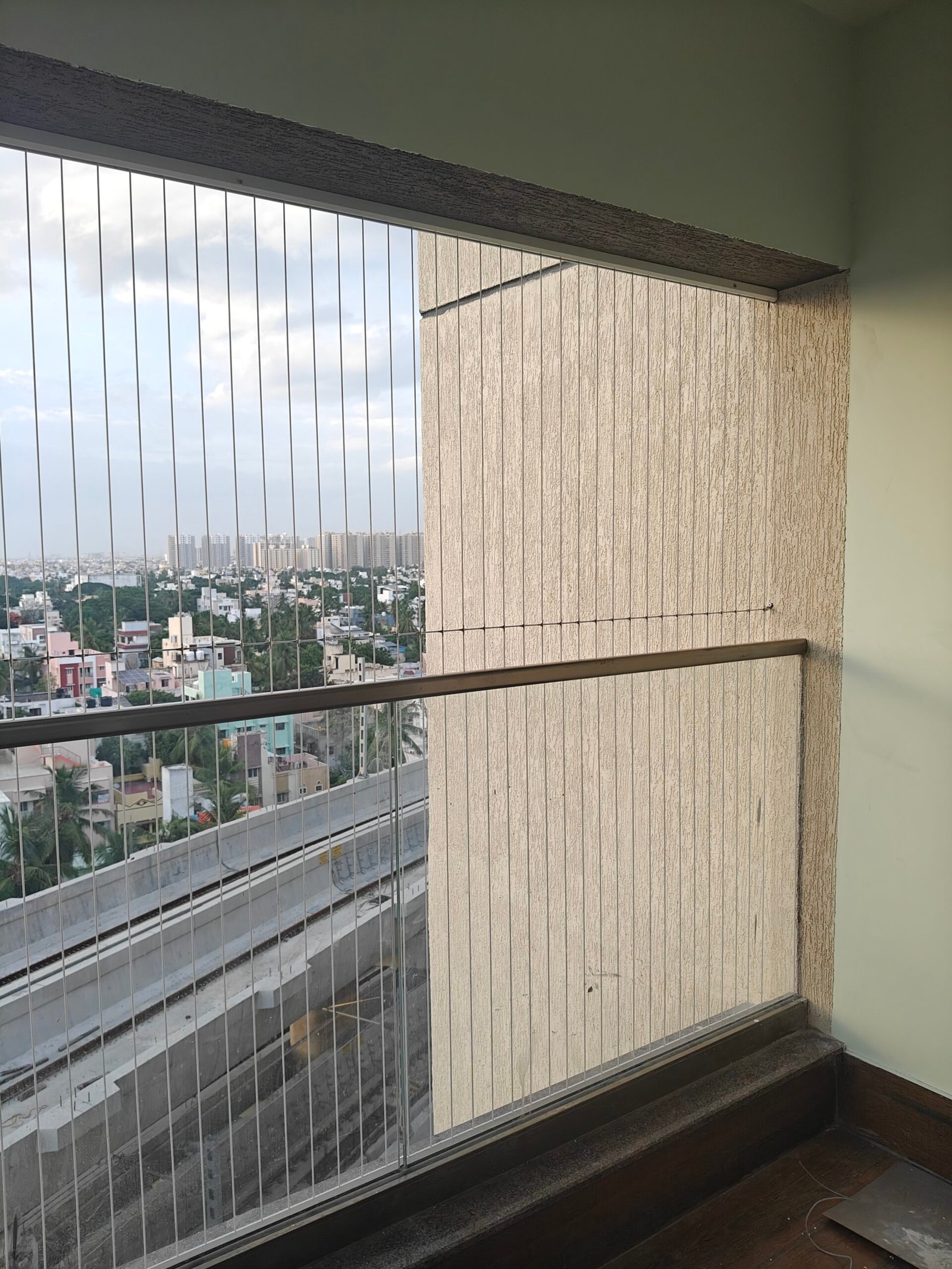 Invisible Grills in Chennai installed on modern balcony